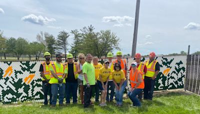 Volunteers complete Decatur fence mural