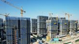 China offers to buy up commercial housing to boost property market