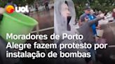 Moradores de Porto Alegre jogam água de enchente em rodovia como protesto por mais bombas; vídeo