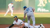 Deadspin | A's snuff late rally, edge Royals