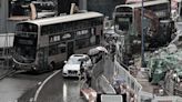 Pedestrians brave flooding outside MTR Kwun Tong Station this afternoon