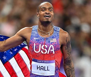 Quincy Hall's brother barks like a dog while reacting to 400m gold