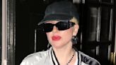 Lady Gaga looks sporty in a satin bomber jacket after dinner in Paris