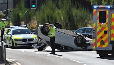 Car flips onto roof after crash near Perth school