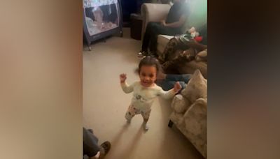 Toddler greets mom's best friend with an adorable happy dance