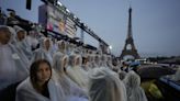 Paris Olympics begins with ambitious but rainy opening ceremony on the Seine River