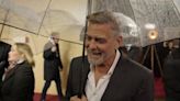 George Clooney jokes about his age as he braves rain for The Boys in the Boat London premiere