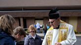 Pets and owners attend Sunday's blessing of animals at St. Joan of Arc church in Cumberland