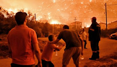 Raging wildfires in central Greece leave two people dead