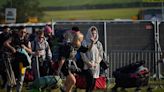 Glastonbury Festival 2024 gates open as brass band plays and revellers rush to pitch tents