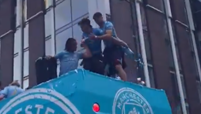Watch: Jack Grealish nearly falls off bus TWICE during Man City title parade
