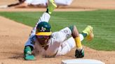 A's Ruiz receives base-stealing advice from Rickey Henderson