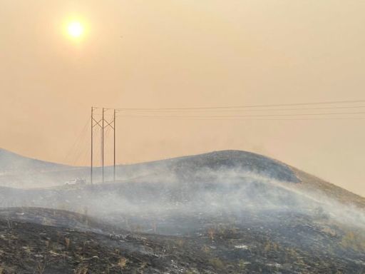 A man is accused of pushing a burning car into a gully, causing a California wildfire that’s spread to over 145,000 acres