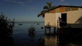 Fiji, moving villages inundated by rising seas, wants big emitters to pay