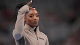 Simone Biles cruises to 9th national title and gives Olympic champ Sunisa Lee a boost along the way