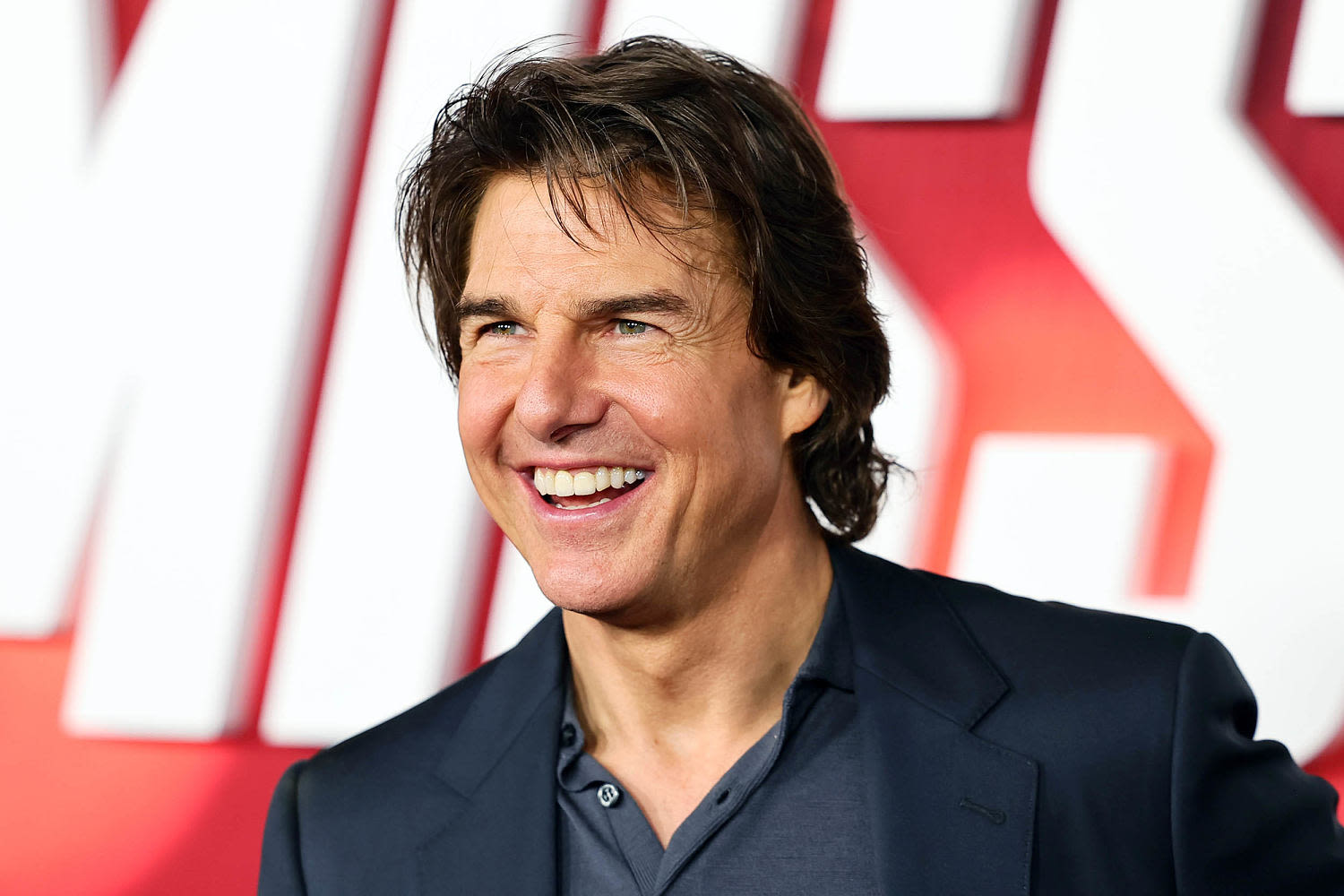 Tom Cruise wraps Olympics closing ceremony by jumping from the stadium roof