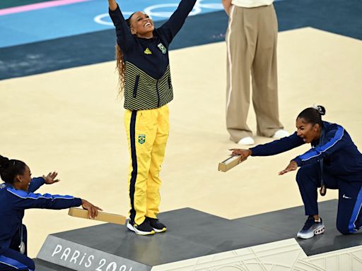 6 photos of Simone Biles and Jordan Chiles bowing down to Rebeca Andrade after her gold medal win