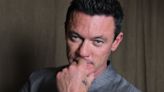 Luke Evans on fashion, marriage and body image: ‘I wasn’t pretty or flawless – I looked like a bloke’