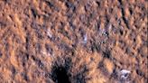 Mars lander discovers massive crater created by meteoroid near Martian equator, unearths buried ice