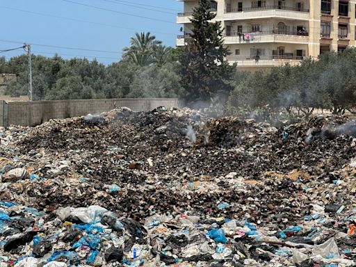 Huge mounds of rotting trash pile up around Gaza camps, UNRWA says