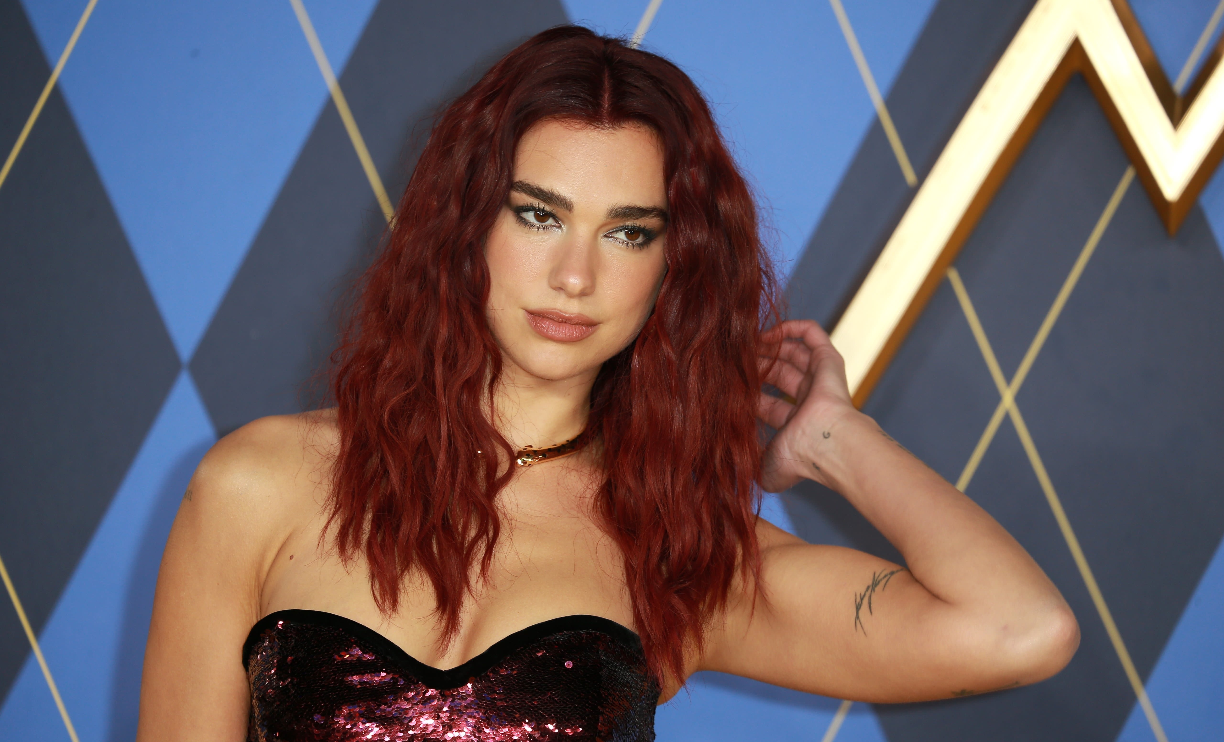 Dua Lipa dishes on her love for the gays, learning tough lessons & 'picking herself up'