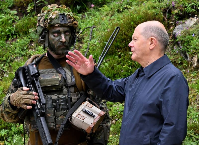 Scholz addresses criticism of German defence spending in troop visit