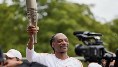 Watch: Snoop Dogg Dances the Olympic Torch Through Paris Suburb Ahead of Opening Ceremony