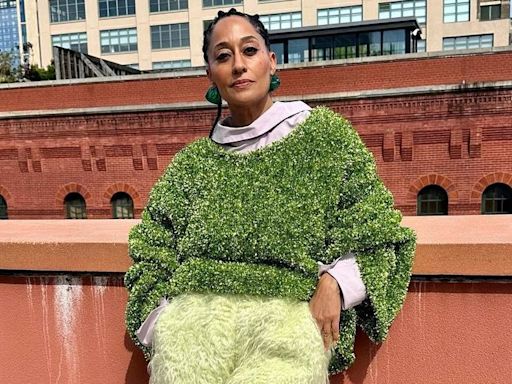 Tracee Ellis Ross Lets Loose in a Grassy Tinsel Sweater and Shaggy Yellow Shorts