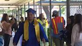 Sacramento high school seniors return to their elementary school in caps and gowns