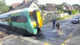 Shocking CCTV shows people risking lives at train level crossings