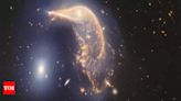 'Cosmic ballet': Nasa unveils stunning images of two galaxies merging in Space - Times of India