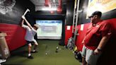 Williams Field coach turns storage room into golf simulator, adds putting green