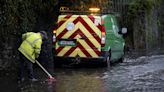 Children carried out of flooded school amid heavy rainfaill in Ireland