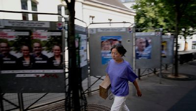 The Latest | Polls are open in France's early legislative election