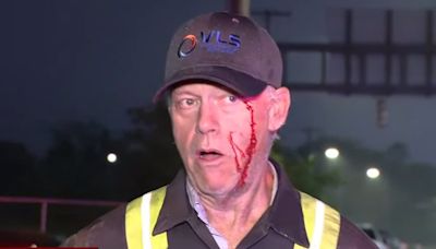 Violent clash in Baltimore as picketing port workers attack trucker