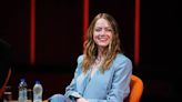 Emma Stone Upgrades Power Suiting in Plunging Wrapped Blazer With Metallic Sandals for ‘Bleat’ Press Conference