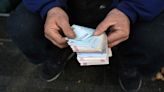 Iran’s currency hits a record low