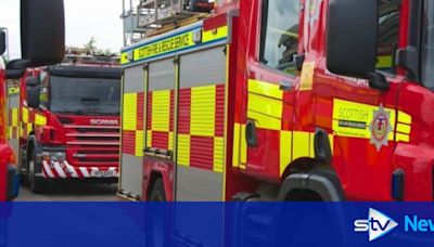 'Remain indoors' warning after 50 firefighters tackle large building blaze