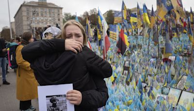 A likely Russian artillery strike kills at least 6 at a Ukrainian market