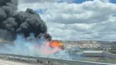 Freight train derailment, fire forces Interstate 40 closure near Arizona-New Mexico line