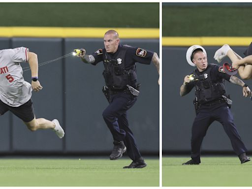 Dramatic Photos Show Moment Officer Tased Reds Fan Who Did Backflip on Field