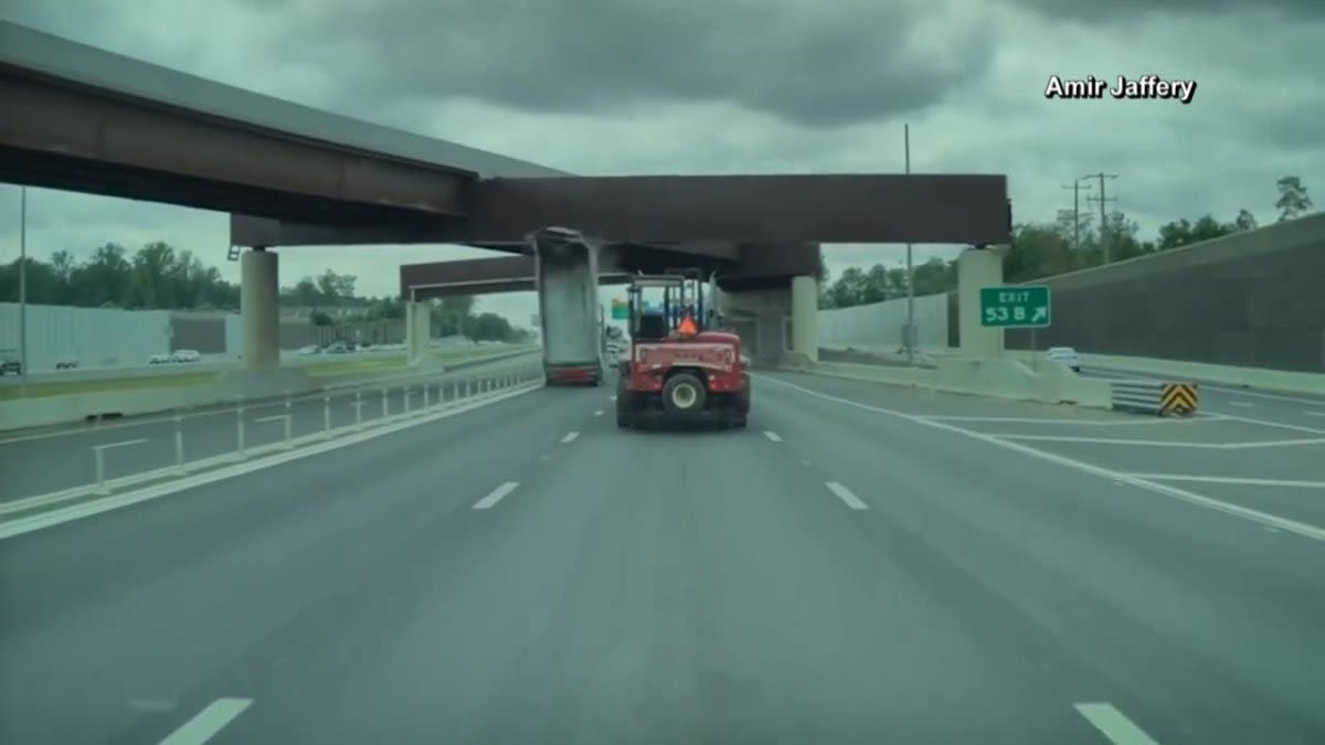 Watch: Dump truck's raised trailer hits overpass bridge in Virginia