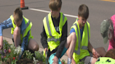Bothwell students help Beautification Committee plant flowers along Front Street