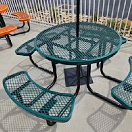 Made of metal, usually steel or aluminum Seats attached to the table Powder-coated for durability Resistant to weather and rust