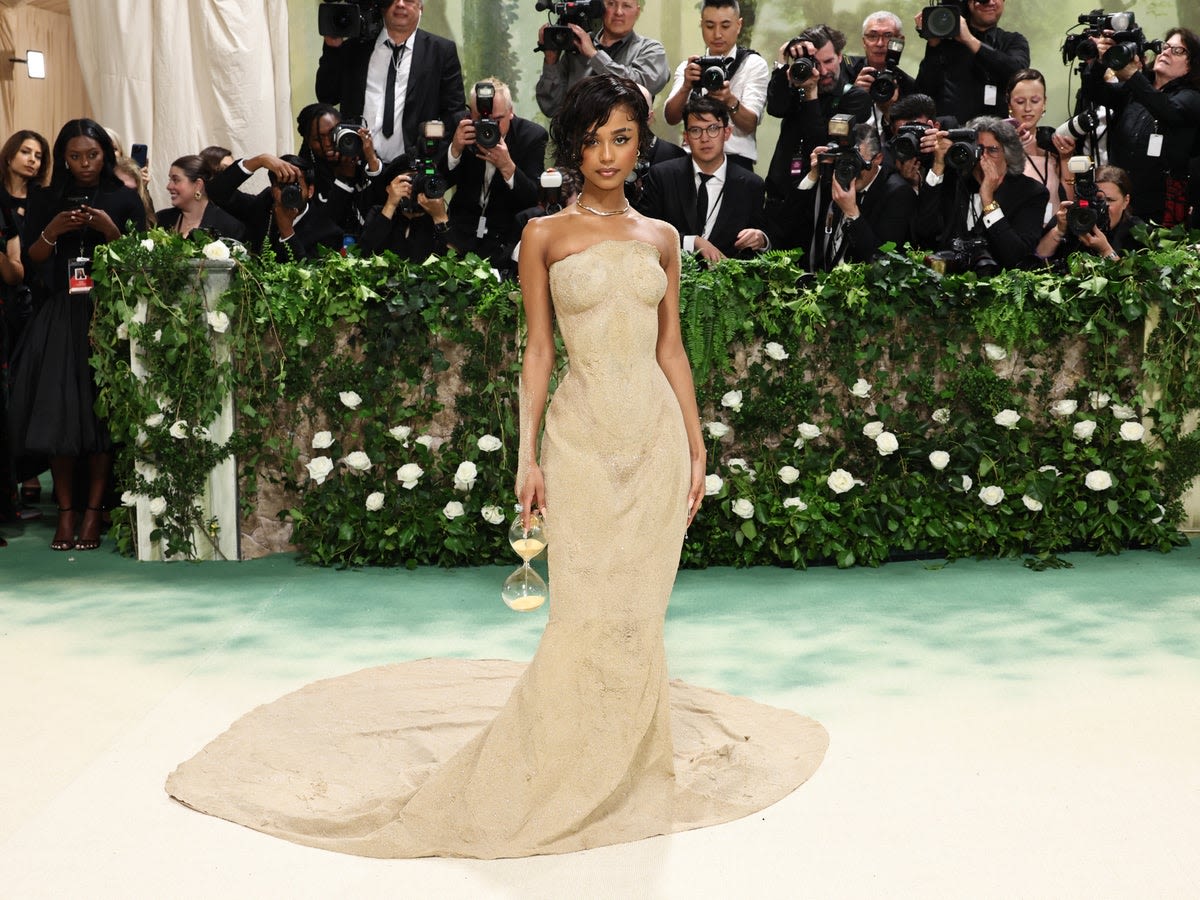 Tyla gets carried up Met Gala steps after struggling to walk in tight sand dress
