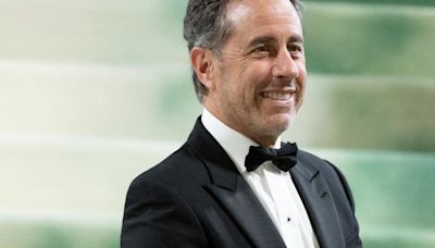 Duke University graduates walk out ahead of Jerry Seinfeld's commencement address