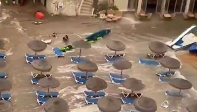 Watch as 'meteo-tsunami' sends Menorca tourists running & washes away sunbeds