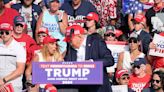Woman sitting behind Trump at rally goes viral for strange behavior