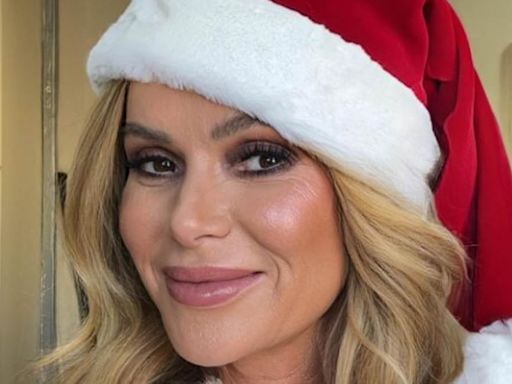 Amanda Holden gets into the festive spirit early in a Santa costume