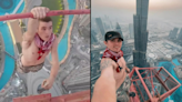 Free climber didn't realise crane had been covered in grease before scaling 1,200ft Dubai tower